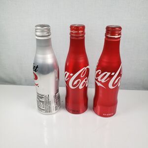 Diet Coca~Cola Aluminum 8.5 oz Diet Coke Bottle is Full with 2 Coca~Cola Empty's